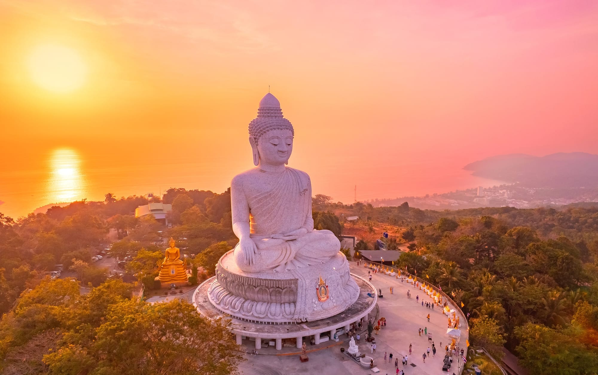 Aerial view of the Big Buddha statue in Phuket, Thailand at sunset — venue destination for the 20th anniversary Global Wellness Summit, November 10-13, 2026